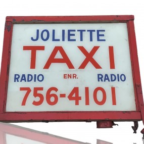 #55768 - 285$ Enseigne publicitaire de Taxi Joliette, affiche vitrée réversible, pancarte, annonce